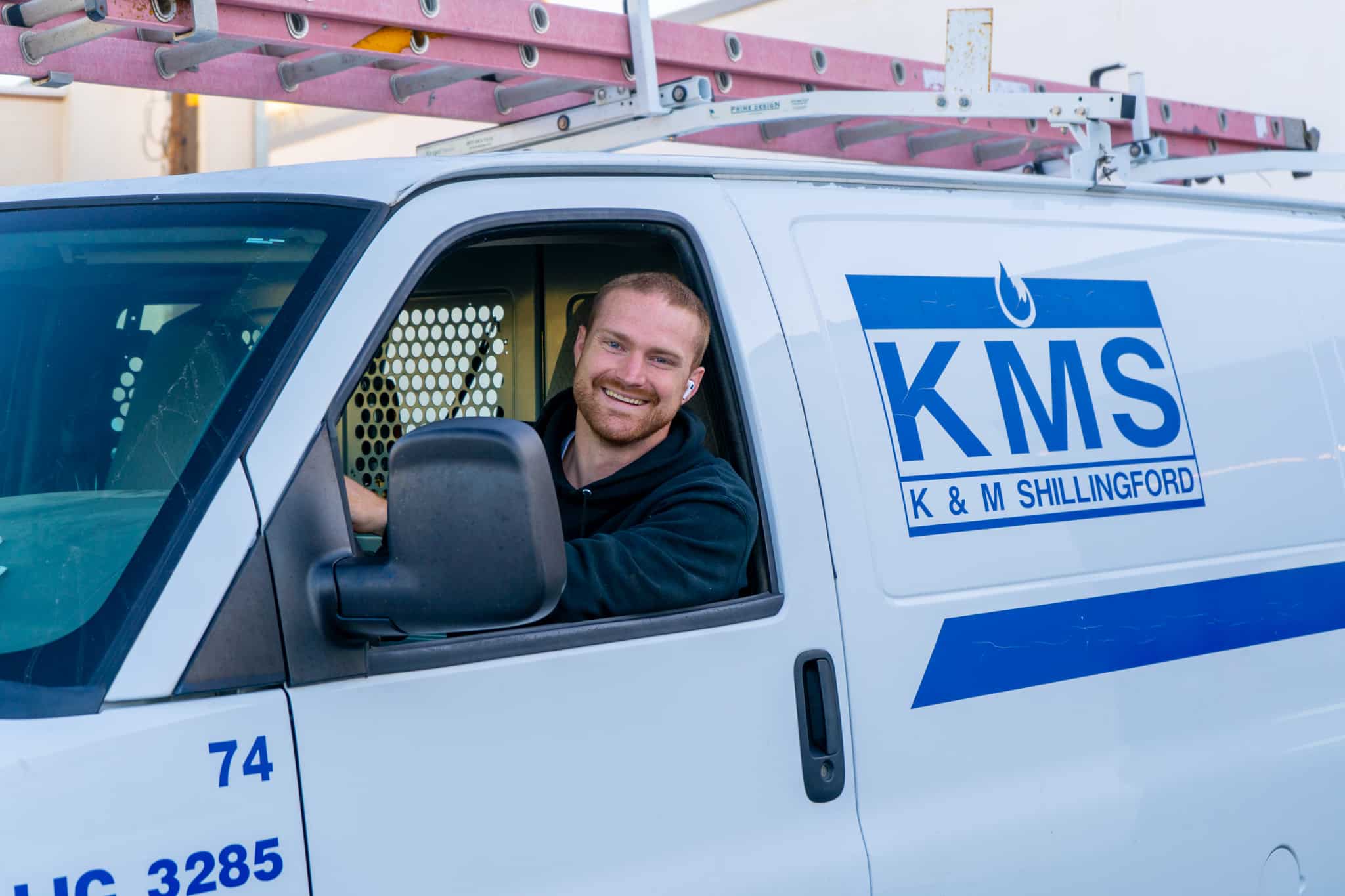 KMS Employee in his van heading to help a customer